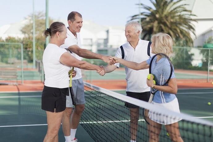 A group of active seniors playing pickleball in one of the 55 plus communities in Clermont, FL