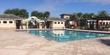 A picture of the clubhouse and amenities at Eagle Creek, Orlando FL, a sought-after community with homes for sale, including the eagle creek orlando fl homes for sale.